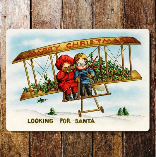 Santa kids plane Christmas holly Metal Sign Plaque